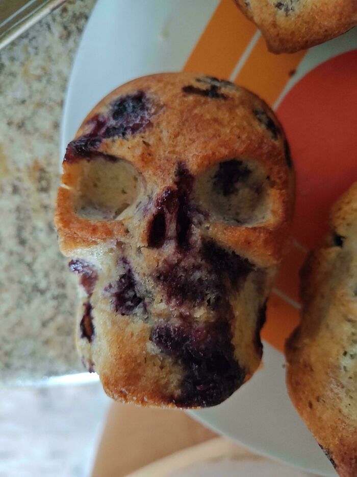 A blueberry muffin shaped like a skull, showcasing amazing treats by talented bakers.