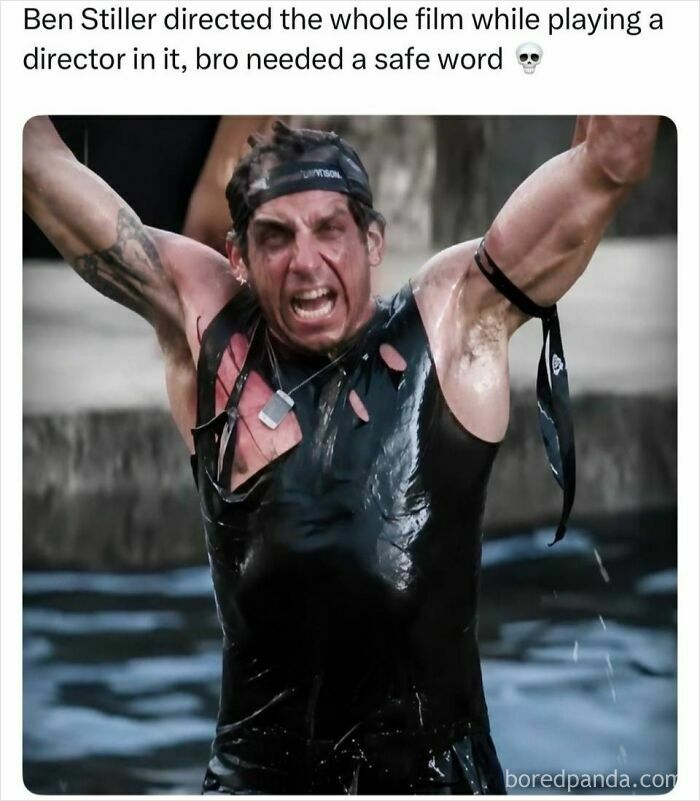 Ben Stiller as a director in a movie scene, yelling with arms raised while wet and covered in mud.