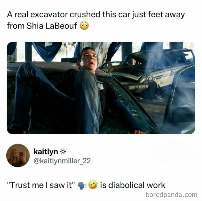 Shia LaBeouf lying on the windshield of a crushed car during a movie scene with an excavator.