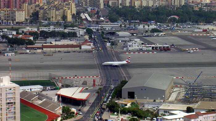 A British Airways plane crosses a busy street in Gibraltar, making your brain question if it was edited.