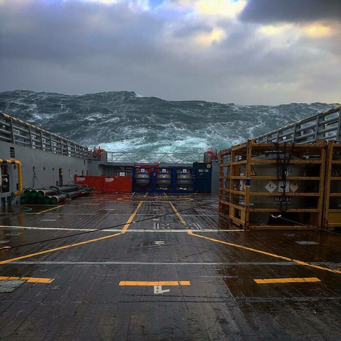 Rough seas seen from a ship deck, displaying a real photo that makes you question if it was edited.