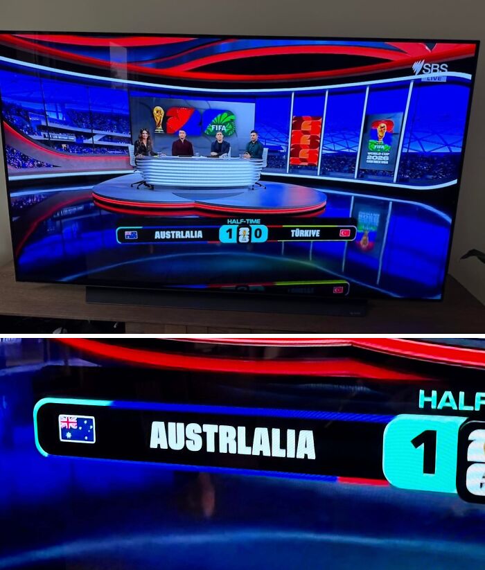 A TV screen shows a half-time score of a soccer match between Australia and Türkiye, an interesting post for an Aussie.