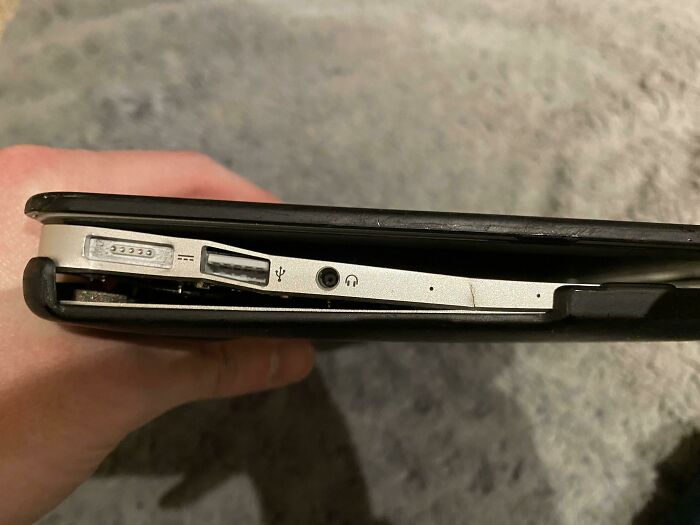A warped laptop battery causing the case to bulge, highlighting something extremely important was forgotten.