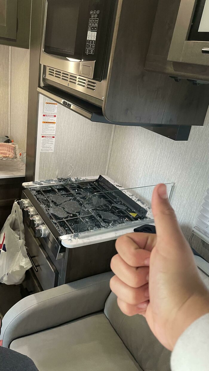 A broken stove top in an RV, a thumbs-up from someone whose day was ruined by forgetting.
