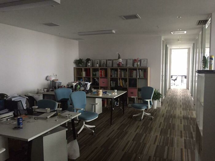 An empty, messy office space with chairs and desks, representing the chaos when forgetting something.