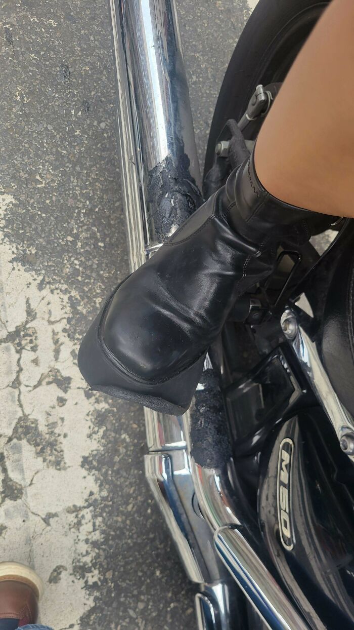 A motorcycle exhaust melted a boot, a classic example of forgetting something important and ruining the day.