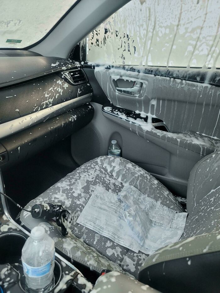 The interior of a car covered in white foam, a vivid example of forgetting something extremely important.