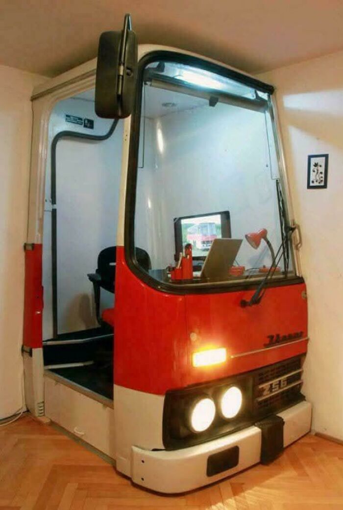 Clever solution: a bus front converted into a home office, turning random junk into a functional workspace.