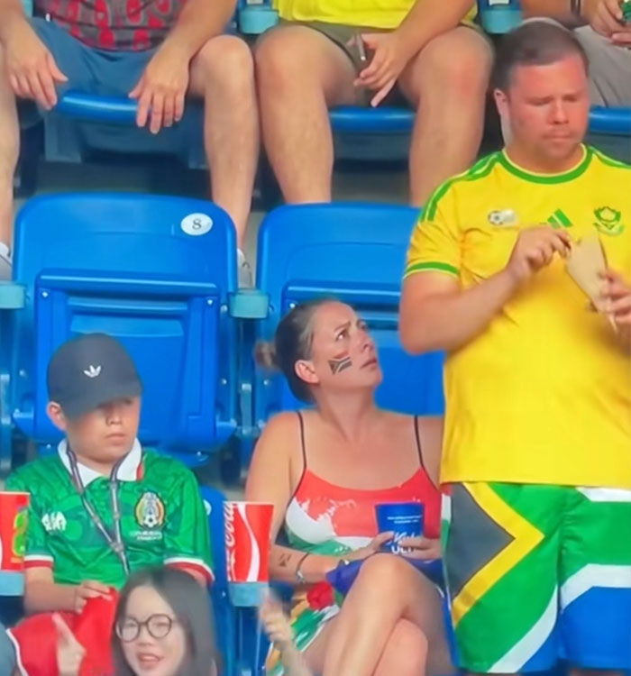 A woman at a World Cup match looks distraught as a man stands beside her, contributing to a viral World Cup moment. A woman at a World Cup match looks distraught as a man stands beside her, contributing to a viral World Cup moment.