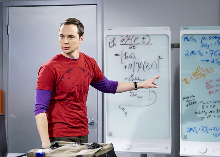 Jim Parsons as Sheldon Cooper from The Big Bang Theory, pointing at a whiteboard with complex equations, highlighting his fame. Jim Parsons as Sheldon Cooper from The Big Bang Theory, pointing at a whiteboard with complex equations, highlighting his fame.