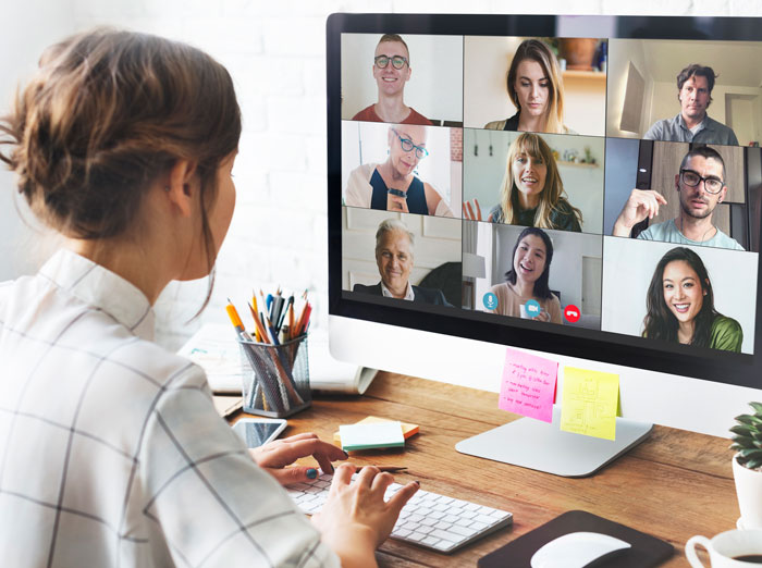 Employee on a video call, possibly dealing with infuriating boss stories while working from home, making them want to quit job.