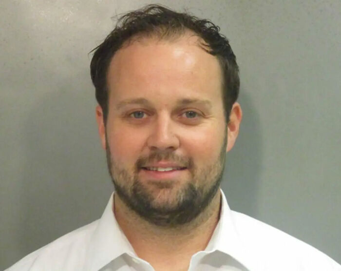 Josh Duggar mugshot, reality star from 19 Kids and Counting, charged with horrific crimes.