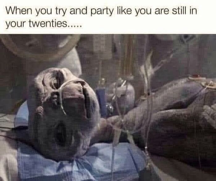 E.T. hooked up to medical equipment, a Gen X meme about partying like you're in your twenties.