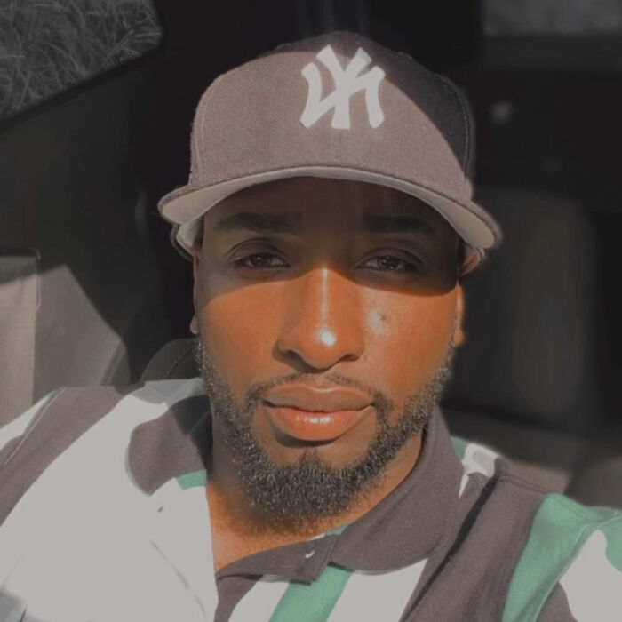 A man wearing a New York Yankees cap, representing the dad involved in the child support dispute. A man wearing a New York Yankees cap, representing the dad involved in the child support dispute.
