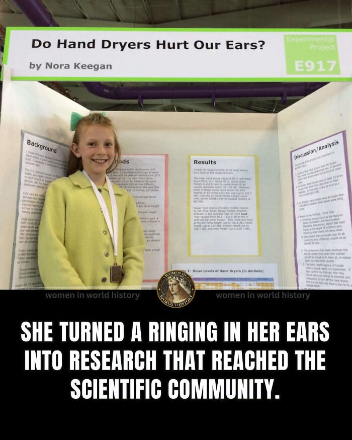 Nora Keegan, a young woman in history, stands proudly next to her science fair project about hand dryers hurting ears.