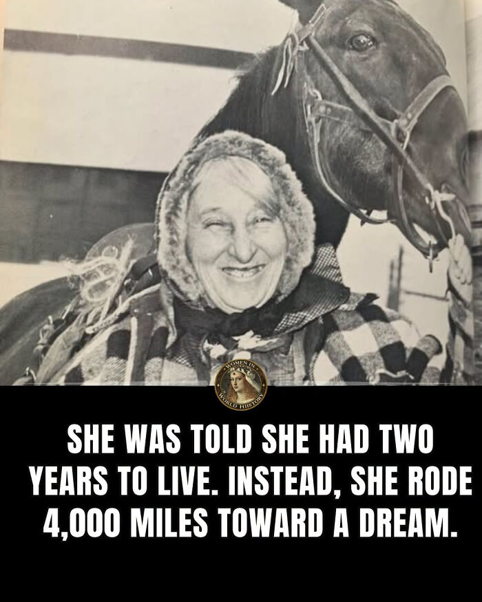 A smiling woman in a hood and plaid with a horse in the background, a powerful example of overlooked women in history.