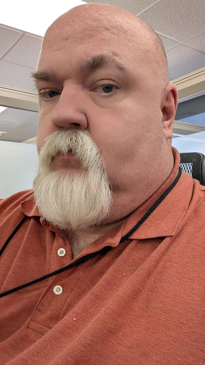 A man with a bald head and white beard, representing surprising facts that don't match people's looks.