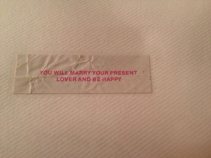 A fortune cookie strip with a positive message, highlighting a rare and happy prediction.