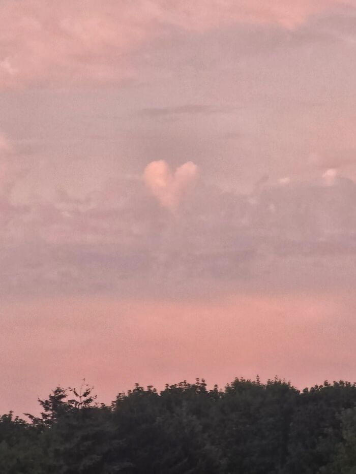 A perfect heart-shaped cloud in a pink sky, a rare and beautiful thing that has happened to them.