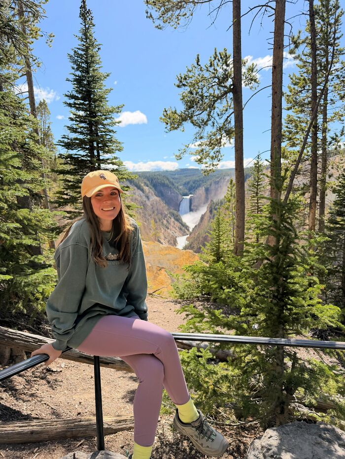 A woman sitting on a rail in front of a waterfall, showing surprising facts that don't match people's looks.