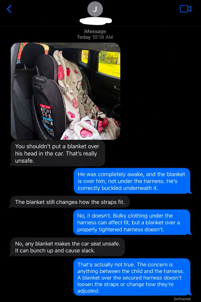 A text conversation with a know-it-all parent debating the safety of a blanket over a child in a car seat.