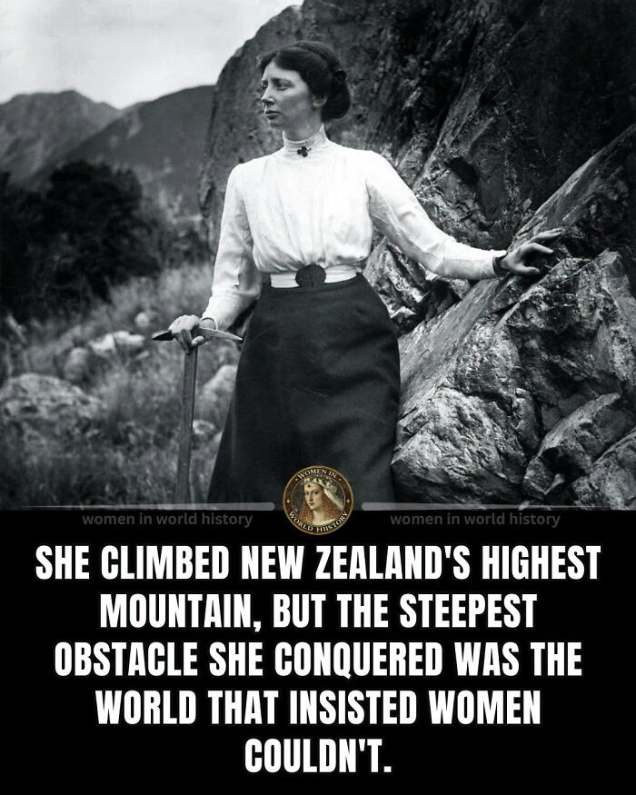 A woman in historical attire standing on a rocky mountainside, symbolizing overlooked women in history.