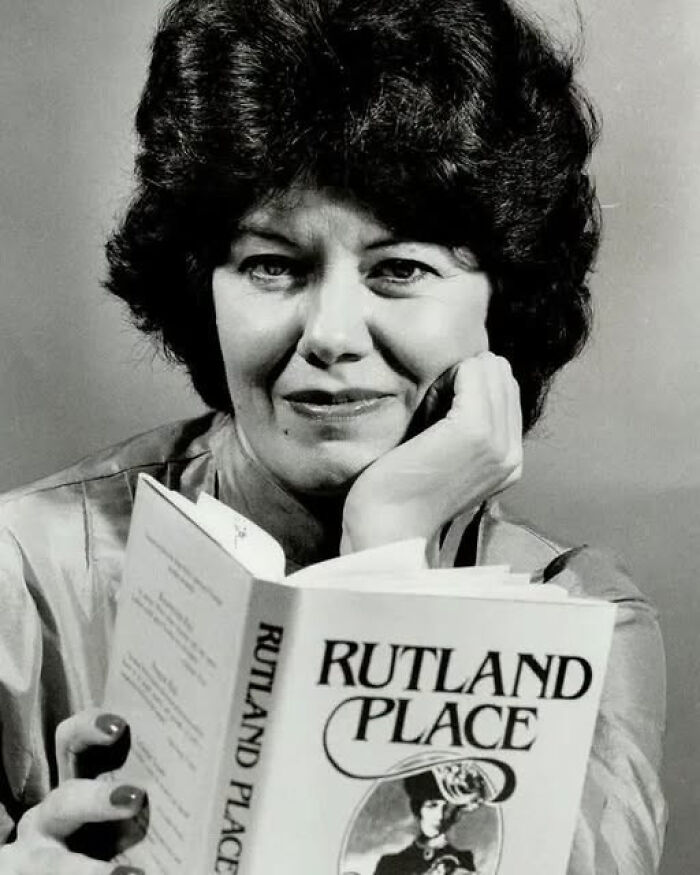 A woman reads a book, highlighting overlooked women in history and their historical contributions.