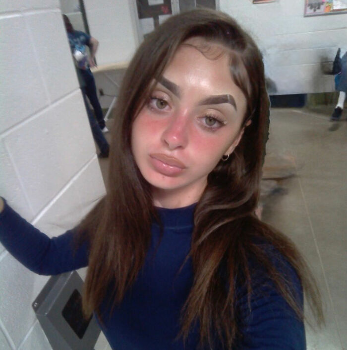 Mackenzie Shirilla prison photo, a selfie showing her with long hair and a dark top, with red cheeks. Mackenzie Shirilla prison photo, a selfie showing her with long hair and a dark top, with red cheeks.