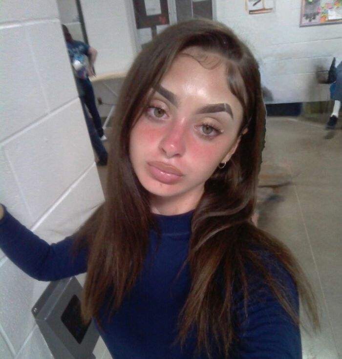 Mackenzie Shirilla's prison selfie stirs controversy, showing her with long hair and a blue shirt in a hallway. Mackenzie Shirilla's prison selfie stirs controversy, showing her with long hair and a blue shirt in a hallway.