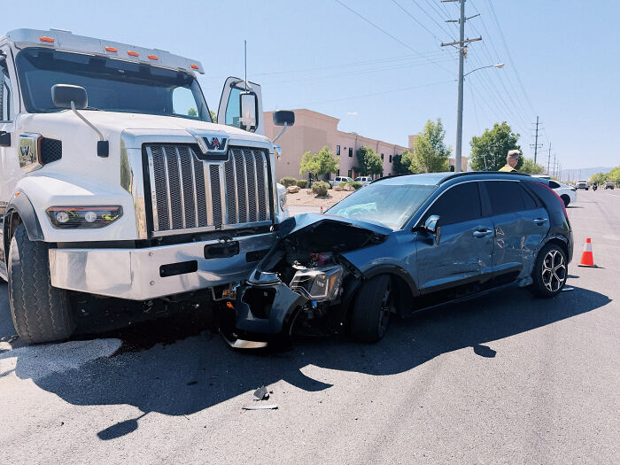 A car crash scene with a blue SUV and a white truck, an unexpected twist and turn that changed people's lives.
