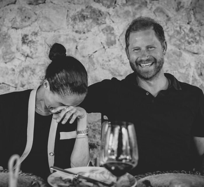 Meghan Markle and Prince Harry laughing together, amidst scrutiny over alleged lies about her upbringing. Meghan Markle and Prince Harry laughing together, amidst scrutiny over alleged lies about her upbringing.