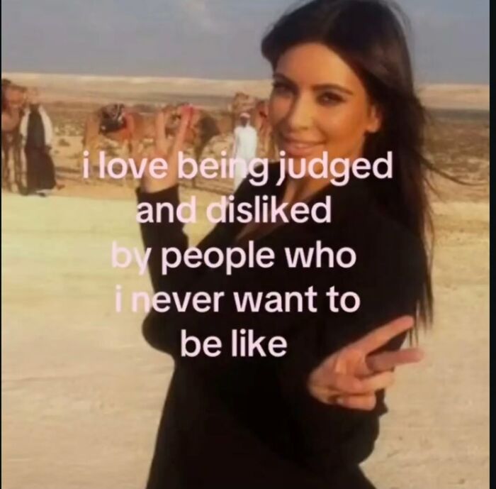 Kim Kardashian making peace signs in a desert, with text about relatable memes: 'i love being judged and disliked by people who i never want to be like'.