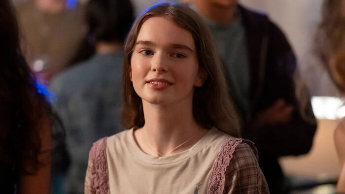 A close-up of a smiling young girl with long hair, in a shot of Stephen King's horror classic reboot. A close-up of a smiling young girl with long hair, in a shot of Stephen King's horror classic reboot.