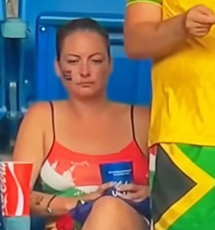 A close-up of a woman at a World Cup match with a sad expression, central to a viral World Cup moment. A close-up of a woman at a World Cup match with a sad expression, central to a viral World Cup moment.