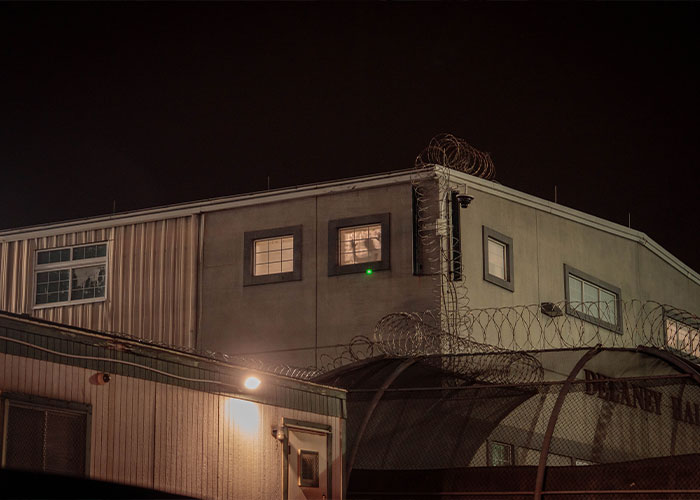 Exterior of a building with barbed wire, relevant to the Canadian woman's case.