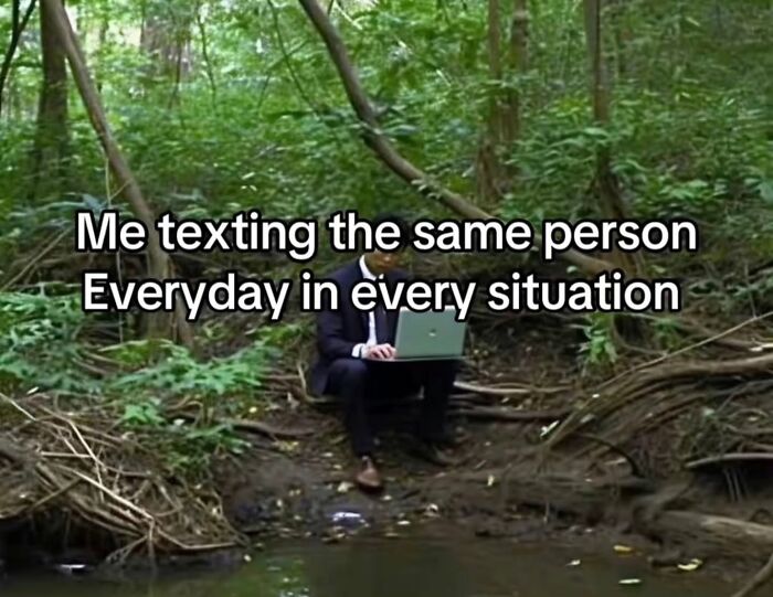 A man with a laptop in a forest, representing relatable memes about constant texting.