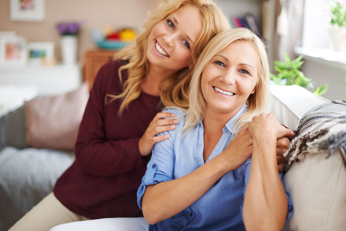 A woman and her GF smiling, depicting the relationship dynamic before mom goes psycho. A woman and her GF smiling, depicting the relationship dynamic before mom goes psycho.