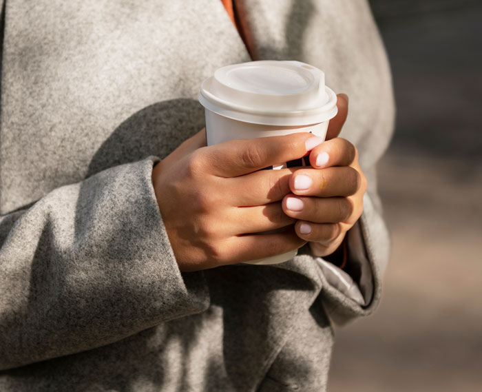 Hands holding a Starbucks cup, symbolizing comfort after the daughter's ordeal with her narcissist mom. Hands holding a Starbucks cup, symbolizing comfort after the daughter's ordeal with her narcissist mom.