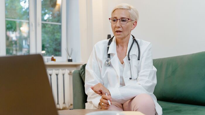 A female doctor on a video call, navigating 'Am I overreacting?' scenarios in her practice.