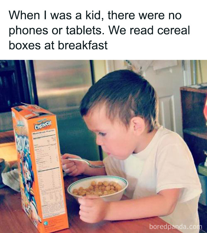 A 90s kid meme showing a young boy eating cereal and reading the cereal box instead of a phone or tablet.