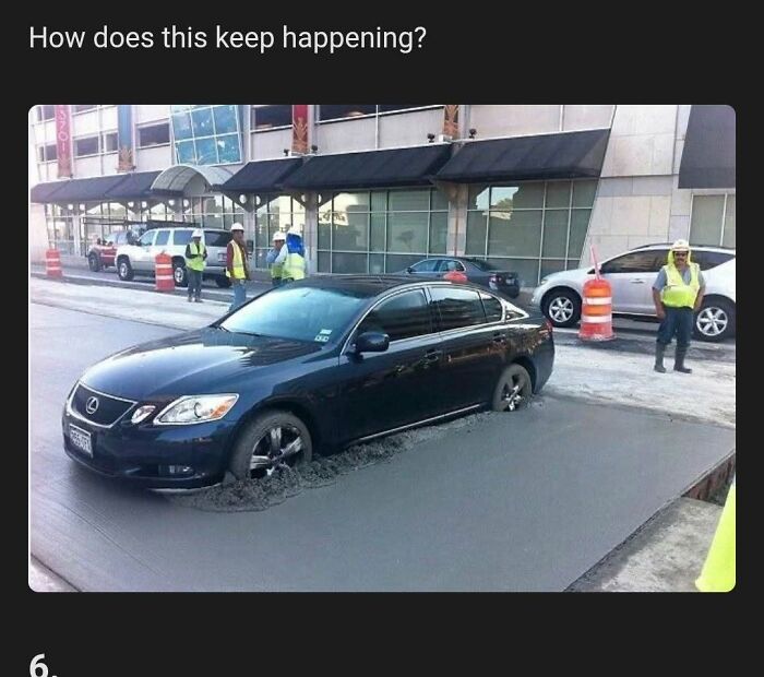 A car stuck in wet cement on a street with construction workers nearby, illustrating a ridiculous post and cultural decline.
