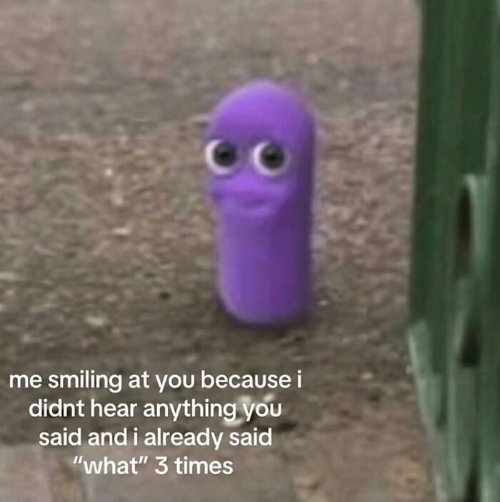 A relatable meme of a purple character smiling awkwardly, illustrating not hearing someone after asking 'what' three times.