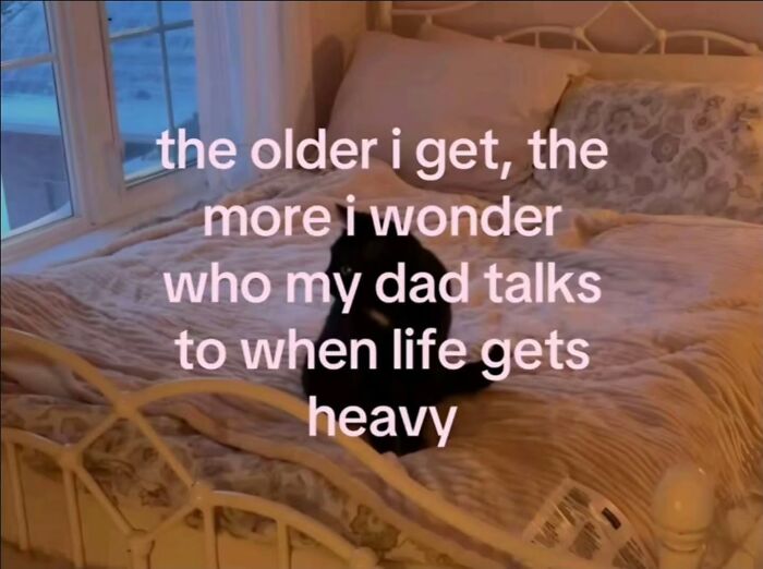 A black cat on a bed with a text overlay, a relatable meme about pondering who dad talks to when life gets heavy.