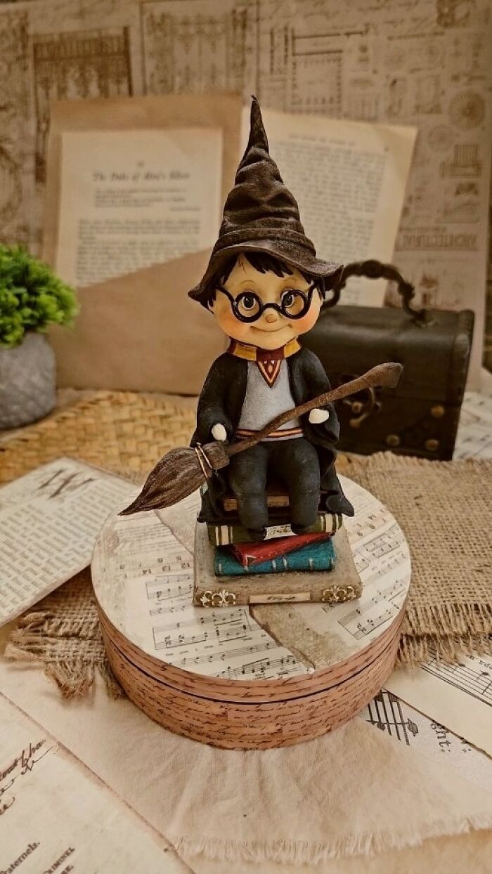 Handmade cotton wool creation of a Harry Potter figurine with a broom, by an artist who creates art.