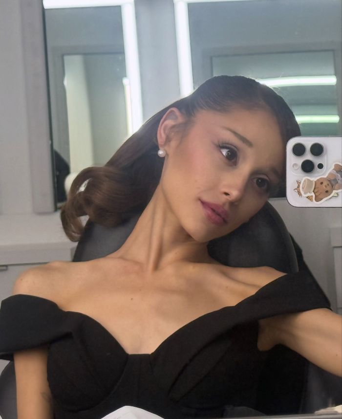 A woman in a black off-the-shoulder top, looking directly at the camera, showing a body type men really want. A woman in a black off-the-shoulder top, looking directly at the camera, showing a body type men really want.