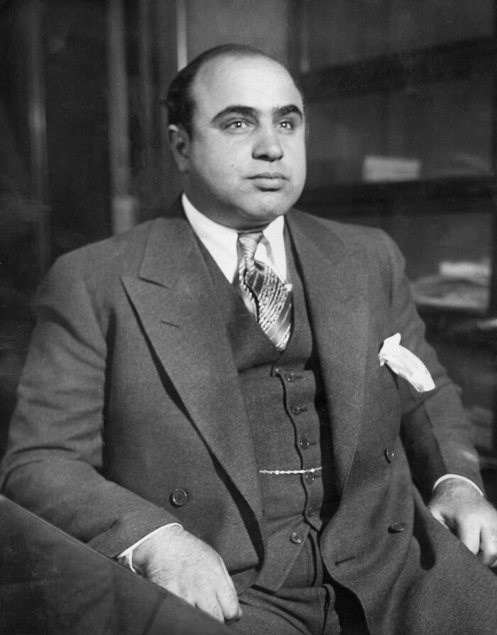 A black and white portrait of Al Capone, a notorious figure linked to many historical mysteries and cases.