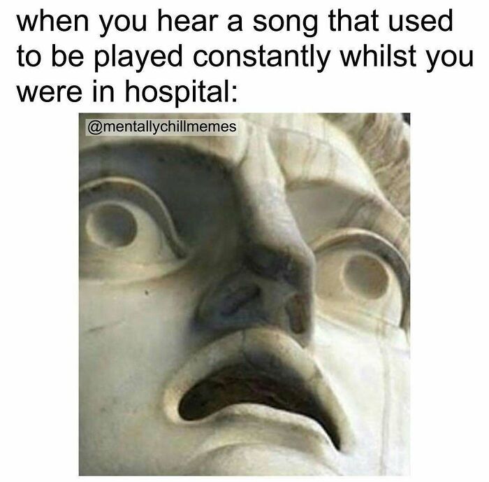 A meme featuring a distressed marble statue face, illustrating a relatable feeling of discomfort when hearing a song from a difficult time.