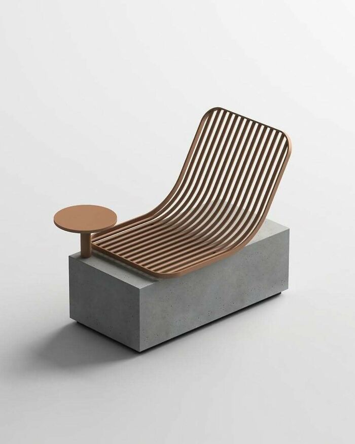 A brilliant design choice: a modern chaise lounge made of wooden slats on a concrete base with an attached side table.