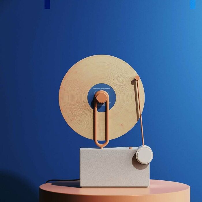 A unique record player with brilliant design choices featuring a light-colored vinyl disc against a blue background.