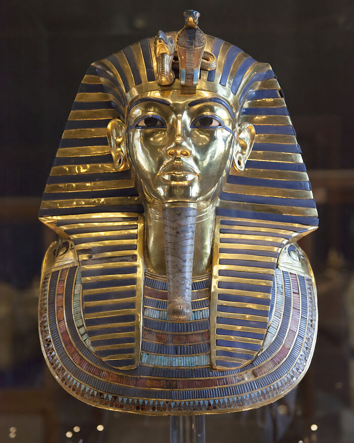 A close-up of King Tutankhamun's golden burial mask, an artifact surrounded by ancient mysteries.